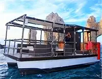 Intimate 25ft catamaran setup for a small group with lounge seating and sunbeds