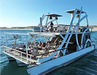 Private catamaran with multiple seating areas, perfect for large gatherings