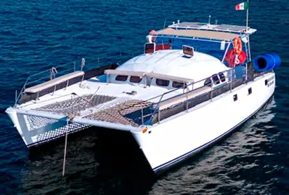 Spacious and modern catamaran available for private charter on the blue waters of Cabo San Lucas.